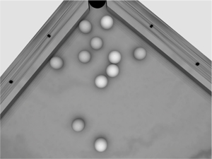 A billiard game session illustrating our algorithm for constraints management (11 balls and 77 inequality constraints).