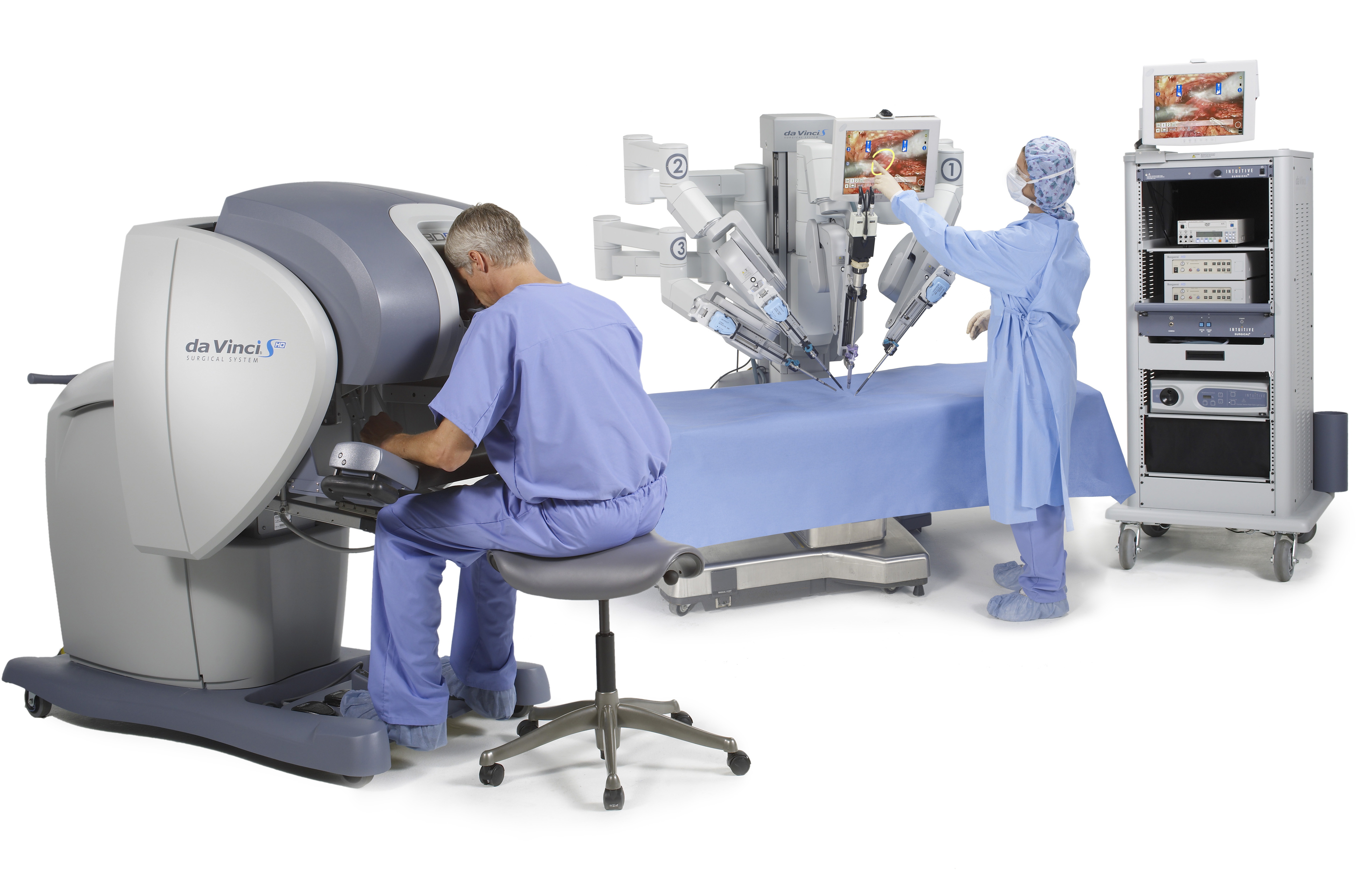 Telesurgery system for one surgeon (left). An assistant (right) is able to see the endoscopic view and draw lines on a touchscreen to visually communicate with the surgeon. © 2014 Intuitive Surgical, Inc.